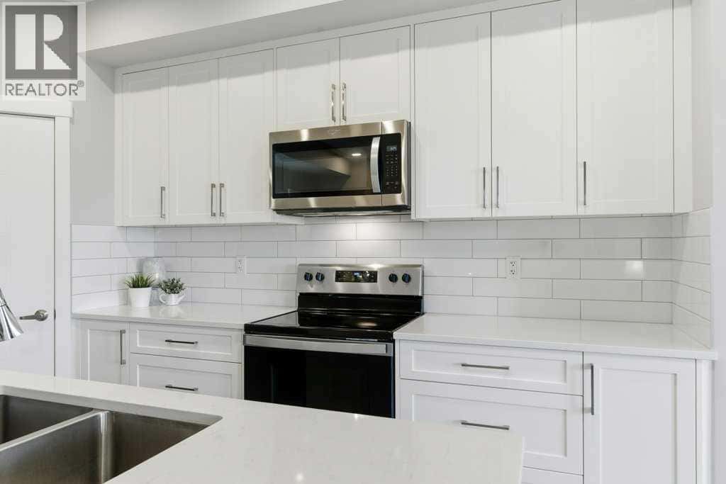 1107, 100 Banister Drive — Okotoks - Photo 5 of 40