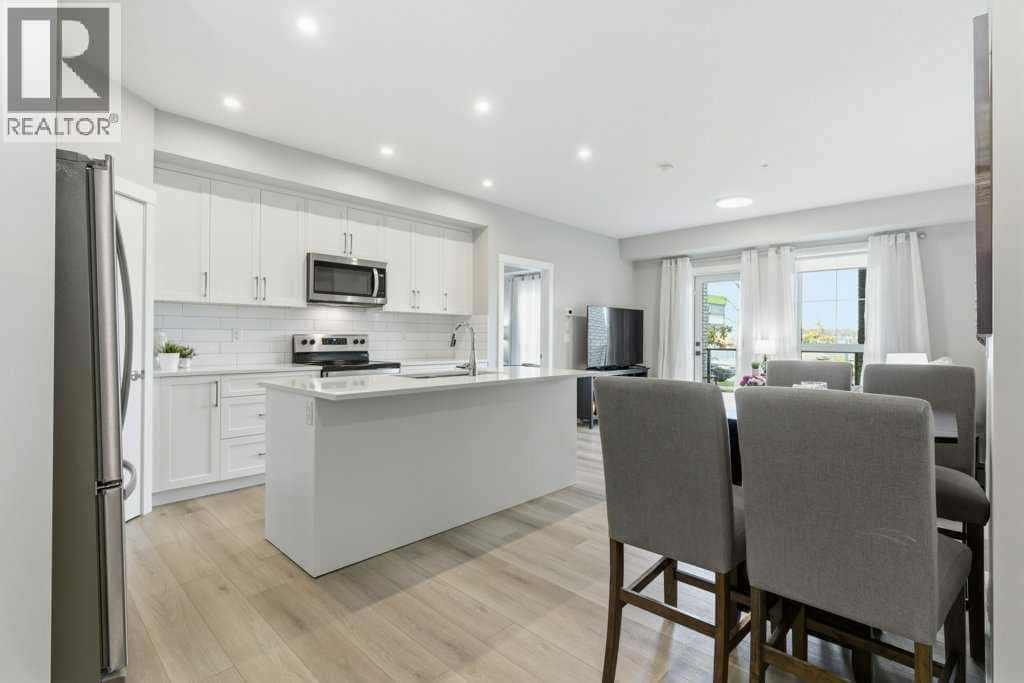 1107, 100 Banister Drive — Okotoks - Photo 4 of 40