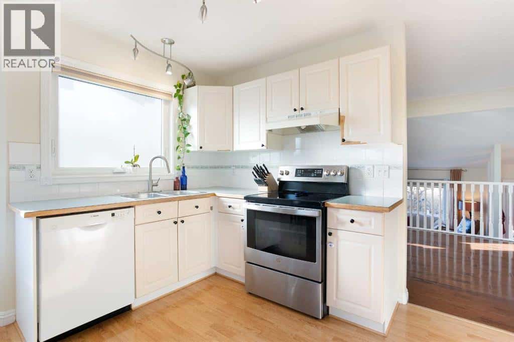 214 Canals Boulevard SW — Airdrie - Photo 2 of 50