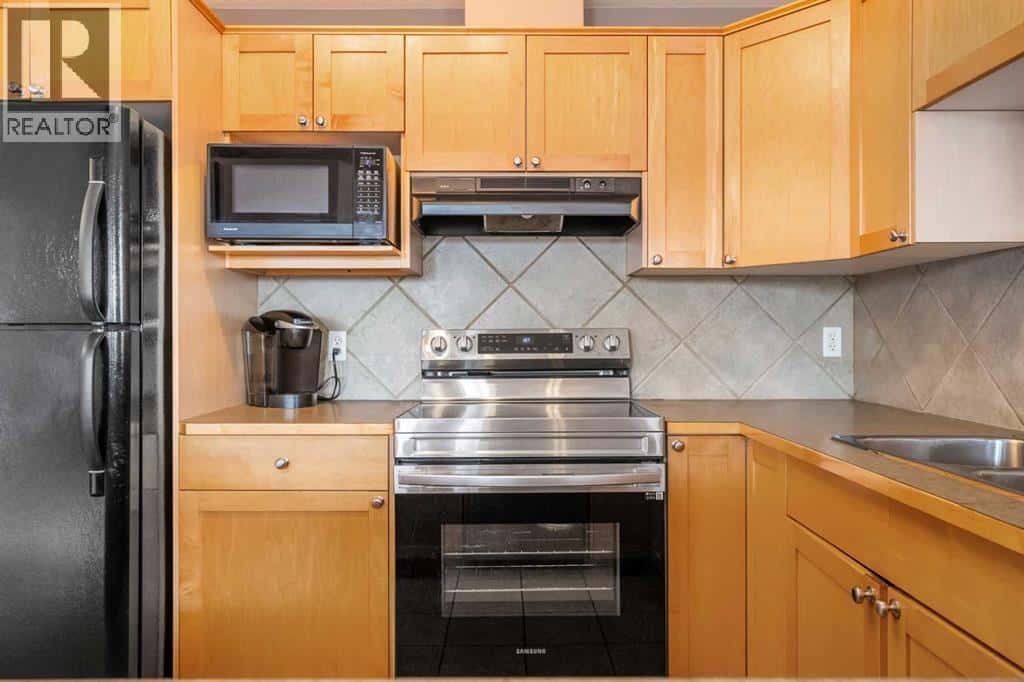 309, 15204 Bannister Road SE — Calgary - Photo 2 of 50