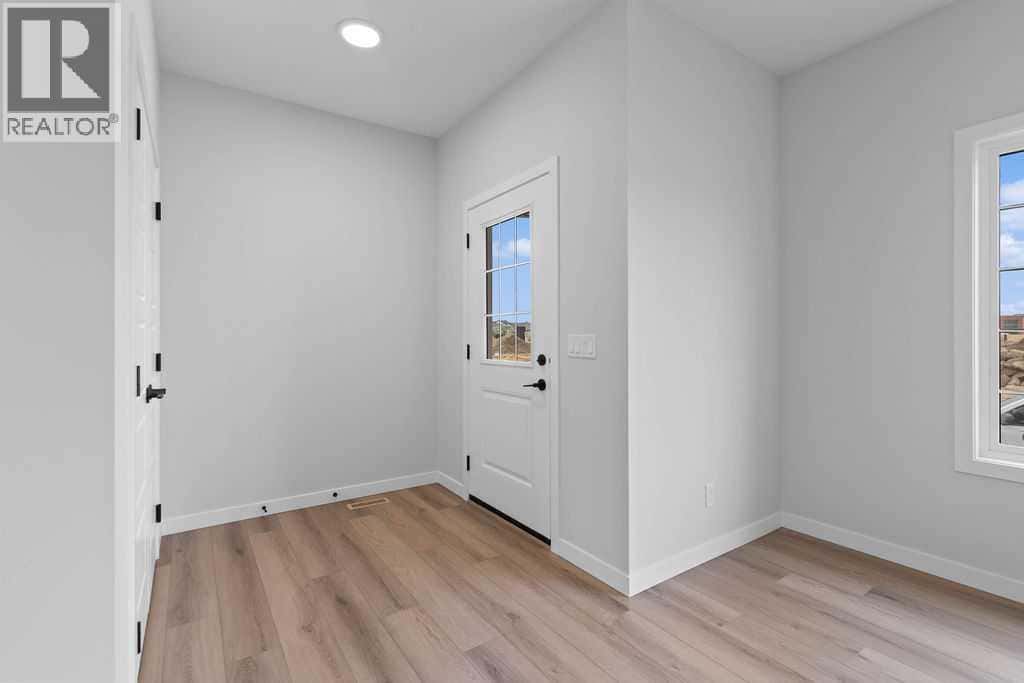 1025 Reynolds Crescent SW — Airdrie, Alberta - Photo 3 of 27