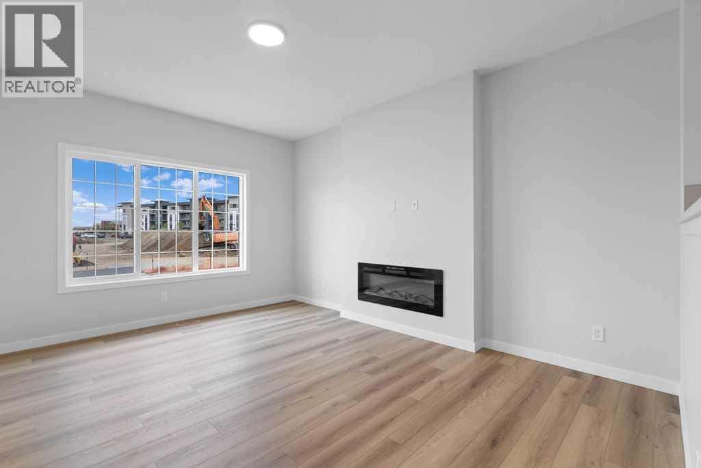 1025 Reynolds Crescent SW — Airdrie, Alberta - Photo 5 of 27